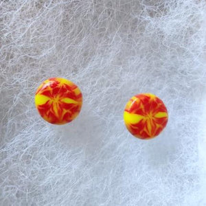 Two red and yellow stud earrings
