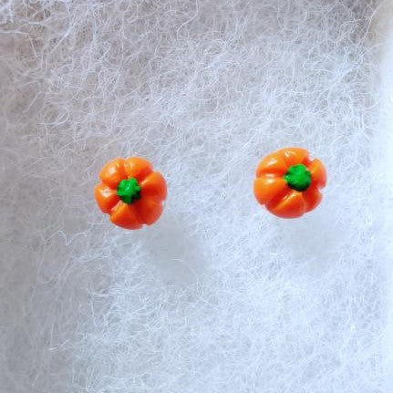Two miniature pumpkin stud earrings