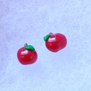 A pair of miniature apple earrings