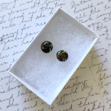 Load image into Gallery viewer, Yellow, black, and orange swirl earrings inside a white paper jewelry box
