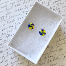 Load image into Gallery viewer, Yellow, blue, and purple swirl earrings inside a white paper jewelry box

