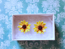 Load image into Gallery viewer, Two sunflower earrings in a white paper jewelry box
