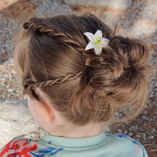 Load image into Gallery viewer, A full hairstyle view of the medium white lily spin in a messy bun hairstyle of blond hair. 
